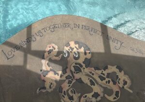 Decorative rug with leopard design and inspirational text about strength and bravery.