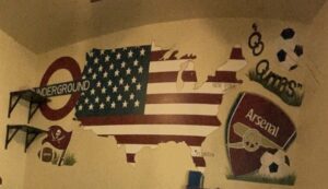 American flag shaped like the USA map on a wall.