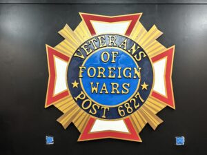 Emblem of Veterans of Foreign Wars Post 682 with patriotic colors.