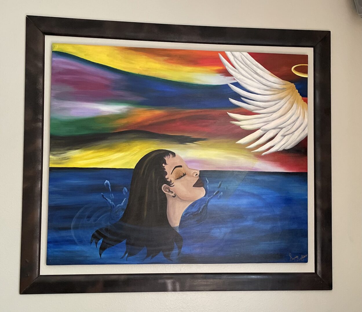 Painting of woman and angel's wing.