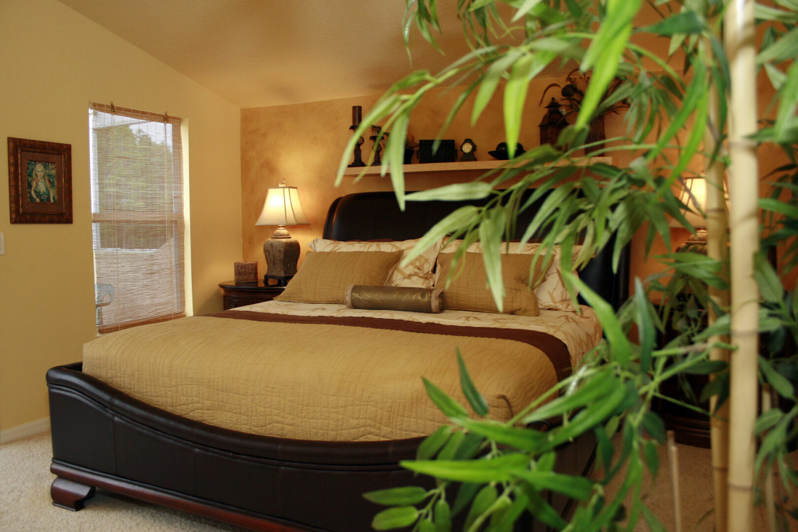 Cozy bedroom with plants and warm lighting.
