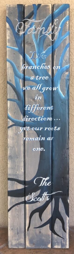 Painted tree with family quote on wood.