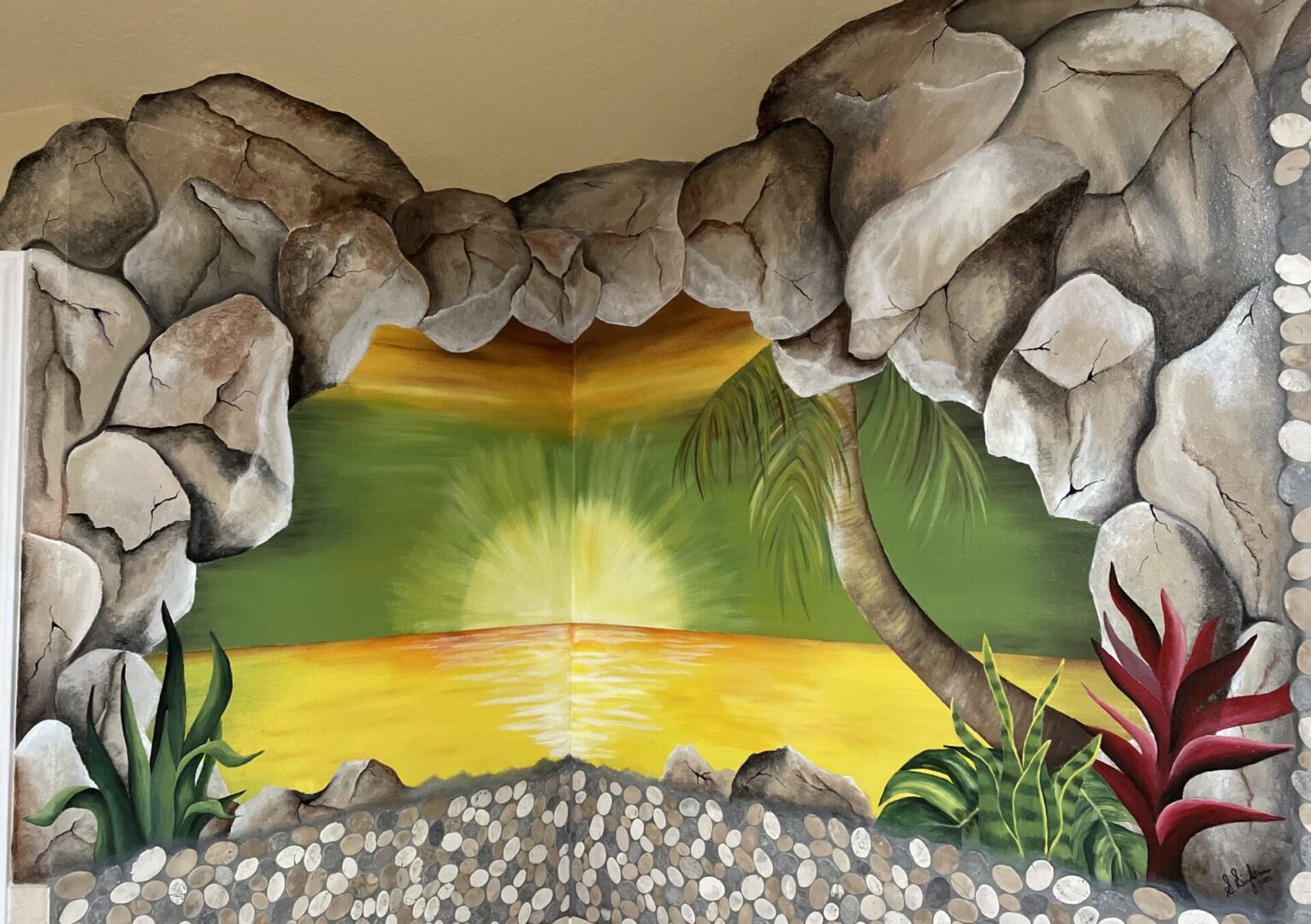 Sunset mural with rocks and plants.